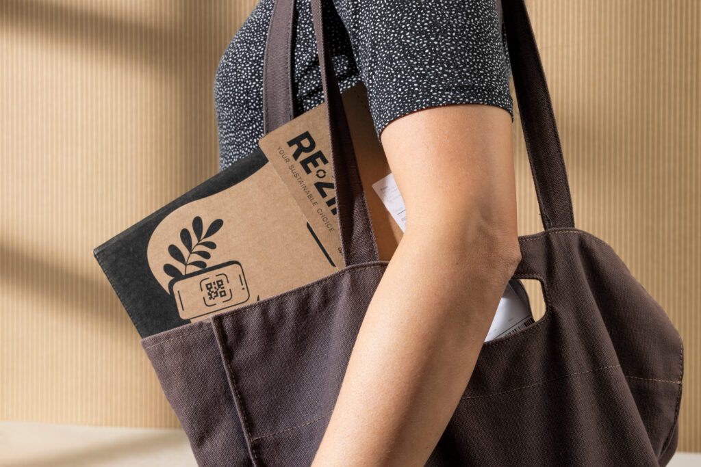 Person carrying reusable RE-ZIP packaging